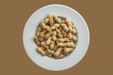 Peanuts on a white plateの写真素材