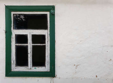old window and dirty ancient wall, copyspace in the image.の写真素材