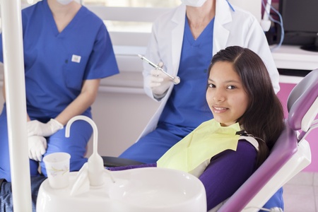 Cute teenage girl happy to visit the dentistの写真素材