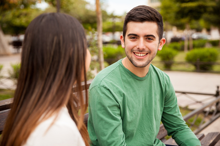 Portrait of a good looking young man having a good time with his date outdoorsの写真素材