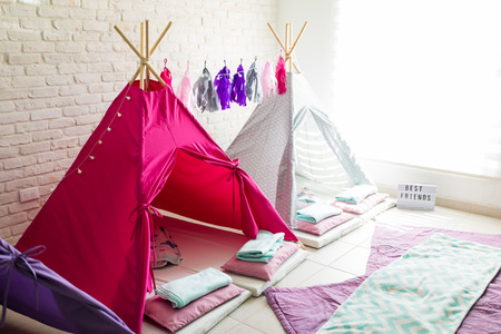 Pink and white teepee tents for pajama party at homeの写真素材