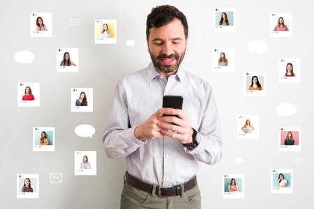 Handsome man in his 30s is using an online dating app in her smartphone and looking at different women's profile. Collage of photos of women in the airの写真素材