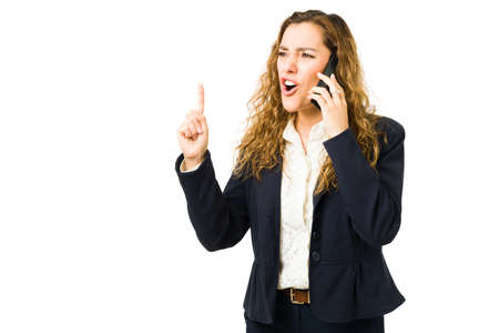 Angry professional woman shouting and screaming to a coworker or client on the phone. Upset...