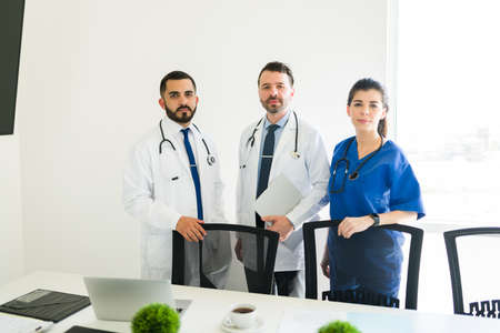 Getting ready to do their rounds. Medical board of the hospital about to have a meeting to do some paperwork and talk about patients informationの写真素材