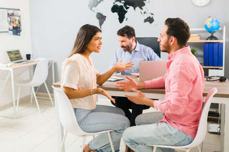 Upset angry husband and wife arguing and having a discussion because they can't agree where to go on...