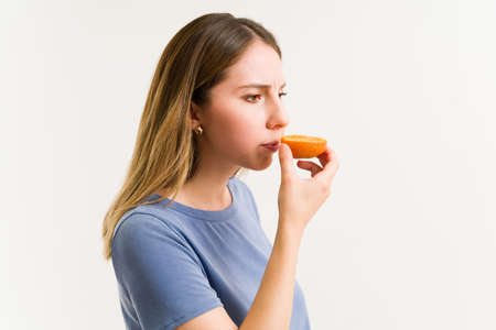 Sick woman can't smell because of anosmia sickness. Young woman with a loss of sense of smell...