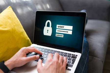 Security authentication and data protection. Young man trying to log into his online account on the...