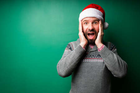 I can't believe it. Surprised latin man receiving good news while feeling happy and shocked