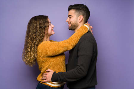 I'm so in love with you. Romantic couple in their 20s looking into each other's eye and sharing their love feelingsの写真素材