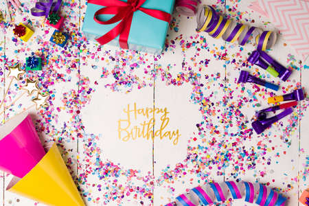 Wear a party hat. Party items to celebrate a birthday with a lot of confetti, serpentines and party...