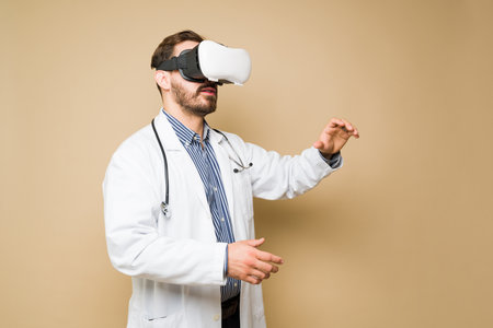 Attractive doctor using virtual reality glasses and technology for health care while workingの写真素材