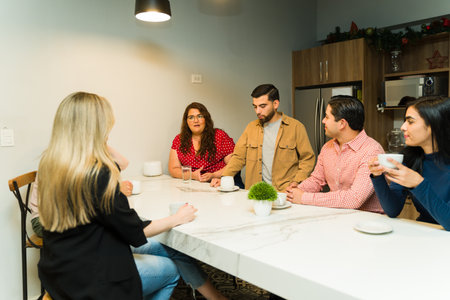Group of office workers sharing some juicy gossip during a coffee break