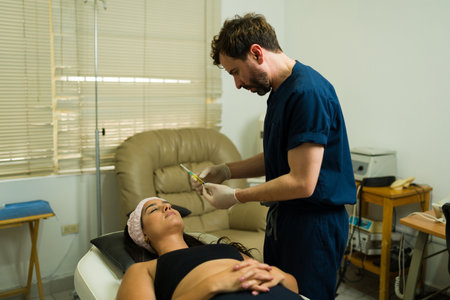 Doctor using alternative medicine at the wellness health clinic putting plasma PRP injections in a patient for a biological regenerative treatmentの写真素材
