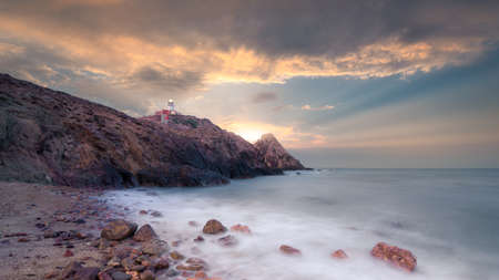Lighthouse and cloudy sky in Cabo de Gata (Almeria) Spainの写真素材