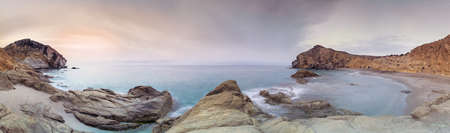 Panoramic of a sunrise in the Cala  los Amarillos, in the Natural Park of Cabo  Gata-Nijar, Almeria...