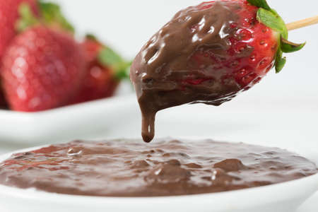 High quality strawberries dipped in a dense sweet chocolate, becoming a delicacy to drink at any time.の写真素材