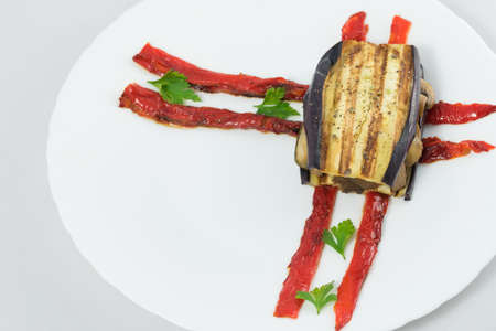 Delicious plate of eggplant, sandwich style, in its interior highlights a portion of mushrooms, zucchini, peppers and aubergine.の写真素材