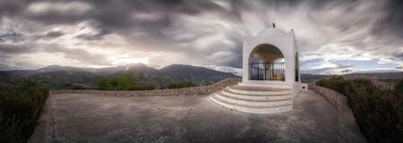 Photograph taken at the highest point of Terque, where you can contemplate a long exposure of a storm sky over the Hermitage of the town of Terque.の写真素材