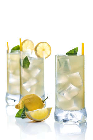 Cold lemonade accompanied with lemons and good grassの写真素材