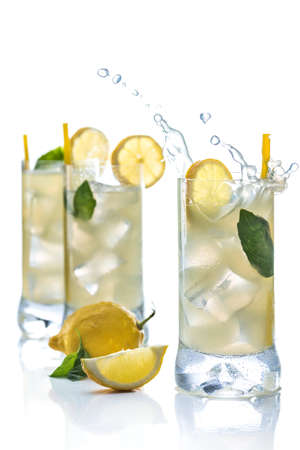 Cold lemonade accompanied with lemons and good grassの写真素材