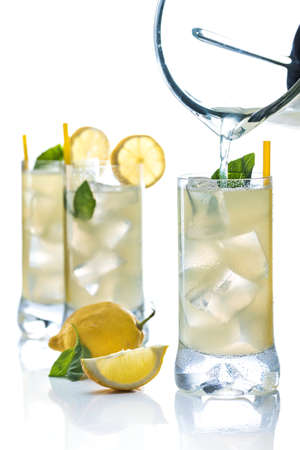 Cold lemonade accompanied with lemons and good grassの写真素材