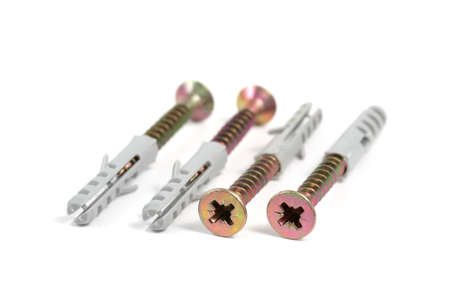 Sheet metal screws with plastic wall anchors with wings 6 on a white backgroundの写真素材