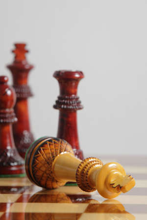 Chess King surrender on a chessboard 