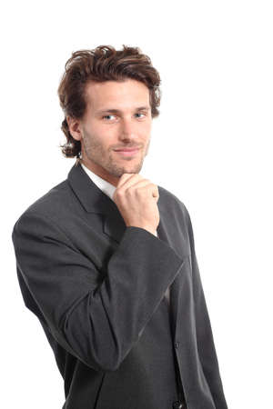 Business attractive young man thinking with a hand on chin on a white isolated background         の写真素材