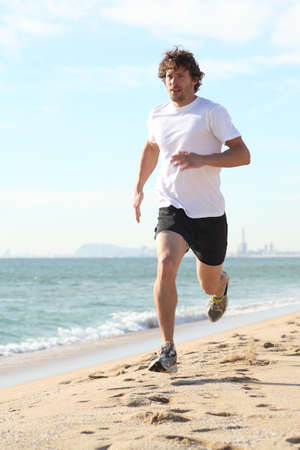 Man running in the beach  Diagonal viewの写真素材