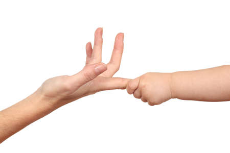 Baby hand grabbing a woman finger in a white isolated background               の写真素材