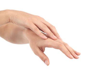 Woman rubbing her hands in a white isolated backgroundの写真素材