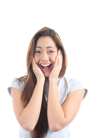 Euphoric woman expression with her hands on the face on a white isolated background             の写真素材