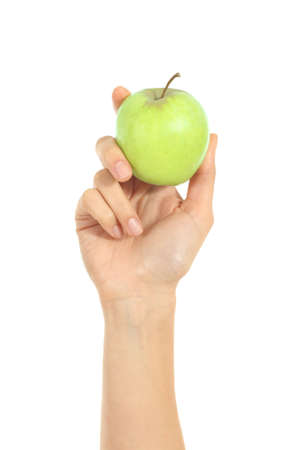 Beautiful woman hand holding an apple in a white isolated backgroundの写真素材