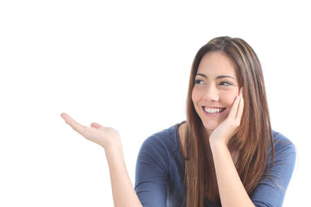 Beautiful woman presenting a blank text on a white isolated background            の写真素材