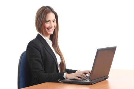 Beautiful  business woman smiling with a laptop and looking at the camera on a white isolated background                の写真素材