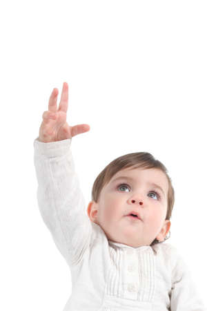Baby trying to reach something up on a white isolated background                 の写真素材