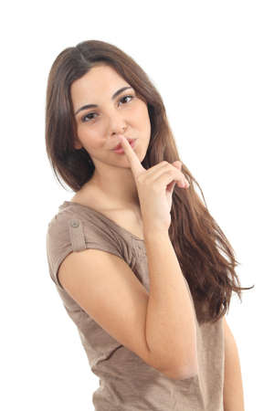 Beautiful woman asking for silence on a white isolated background           の写真素材
