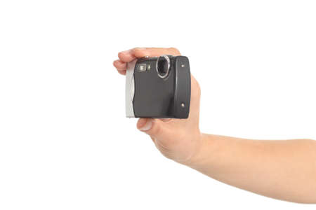 Beautiful woman hands holding a compact camera in a white isolated background              の写真素材