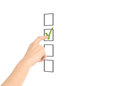 Woman hand checking tick box with a blank space for your text on a white isolated backgroundの写真素材