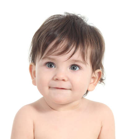 Baby smiling and watching attentive with a big grey eyes on a white isolated backgroundの写真素材