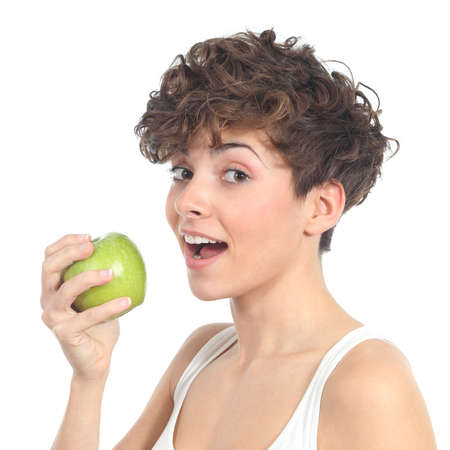 Beautiful woman ready to eat an apple on a white isolated backgroundの写真素材