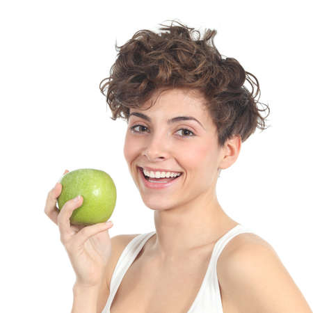 Beautiful woman holding an apple on a white isolated backgroundの写真素材