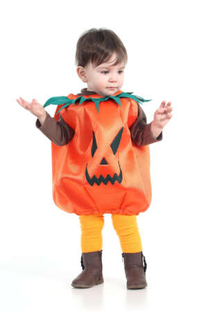 Baby with a halloween pumpkin disguise  on a white isolated background        の写真素材
