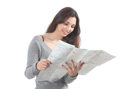Beautiful woman smiling and watching a road map on a white isolated backgroundの写真素材