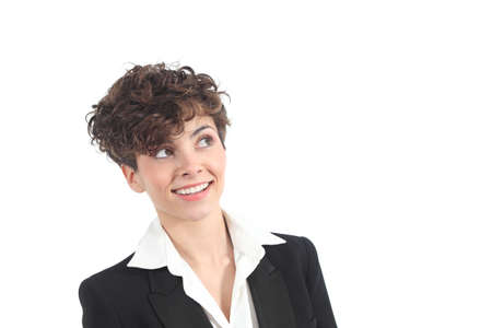 Beautiful businesswoman smiling with her eyes looking above on a white isolated backgroundの写真素材