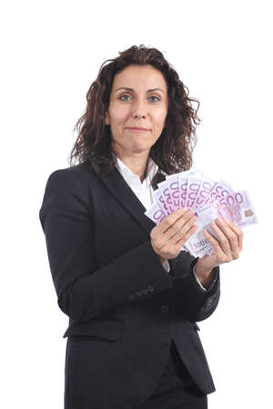 Beautiful mature businesswoman smiling and showing her earnings on a white isolatedの写真素材