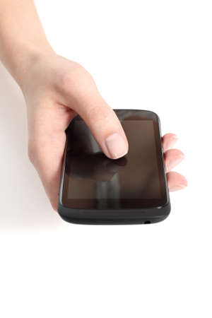 Woman hand touching a touch screen of a mobile phone with her thumb on a white isolated background            の写真素材