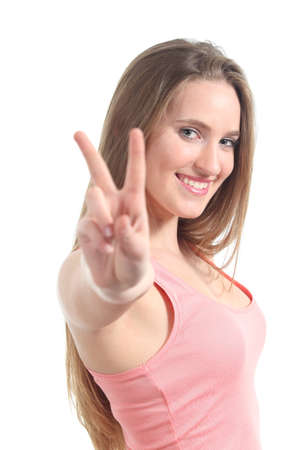 Young beautiful woman making victory or peace gesture isolated on a white backgroundの写真素材