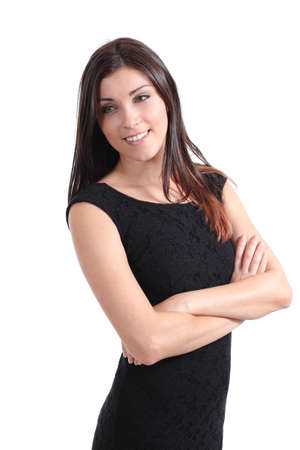 Beautiful woman smiling with her arms folded on a white isolated backgroundの写真素材