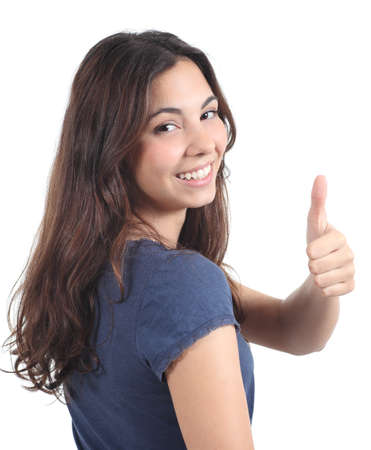 Back view of a beautiful teen with thumb up gesture on a white isolated backgroundの写真素材